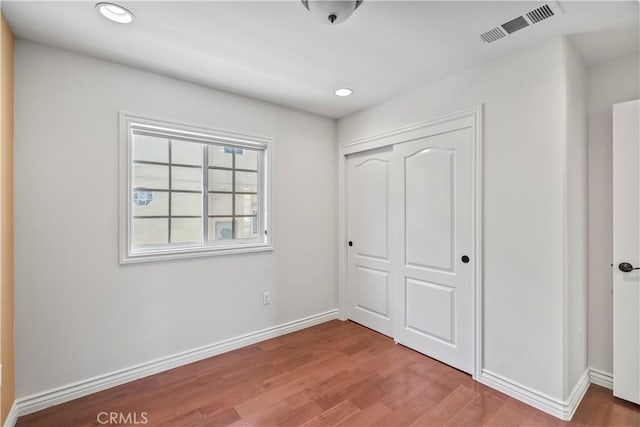1128 Huntington Dr Unit C, South Pasadena, CA 91030 - unfurnished bedroom featuring wood finished floors, a closet, and recessed lighting