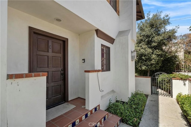 1128 Huntington Dr Unit C, South Pasadena, CA 91030 - view of exterior entry with stucco siding and a gate