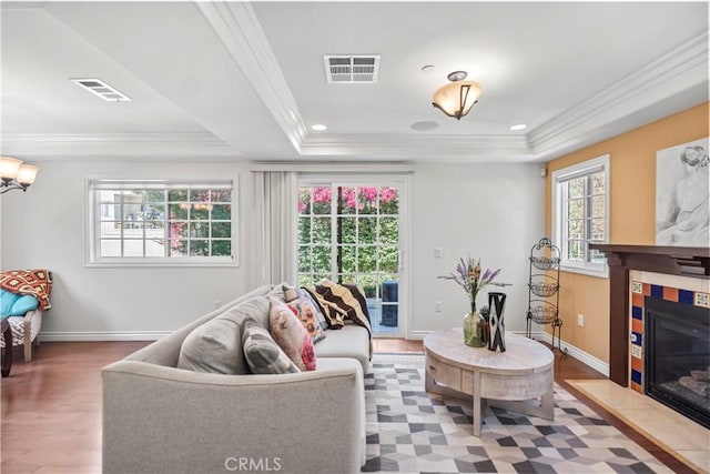 1128 Huntington Dr Unit C, South Pasadena, CA 91030 - living area with a tray ceiling, a tile fireplace, wood finished floors, and crown molding
