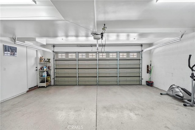 1128 Huntington Dr Unit C, South Pasadena, CA 91030 - garage featuring a garage door opener and concrete block wall