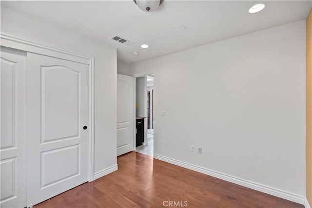 1128 Huntington Dr Unit C, South Pasadena, CA 91030 - unfurnished bedroom featuring wood finished floors, a closet, and recessed lighting