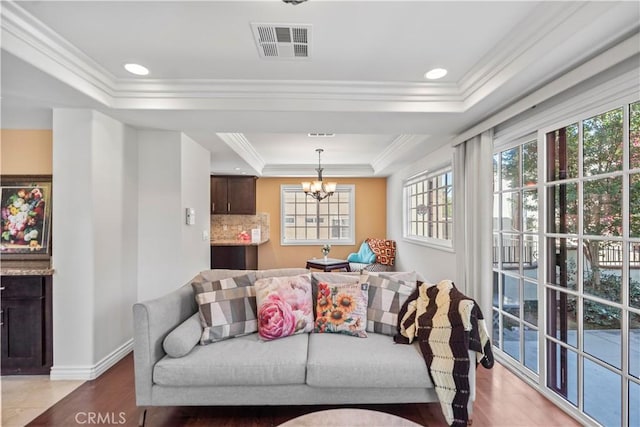 1128 Huntington Dr Unit C, South Pasadena, CA 91030 - living area with a raised ceiling, plenty of natural light, a chandelier, crown molding, and light wood-type flooring