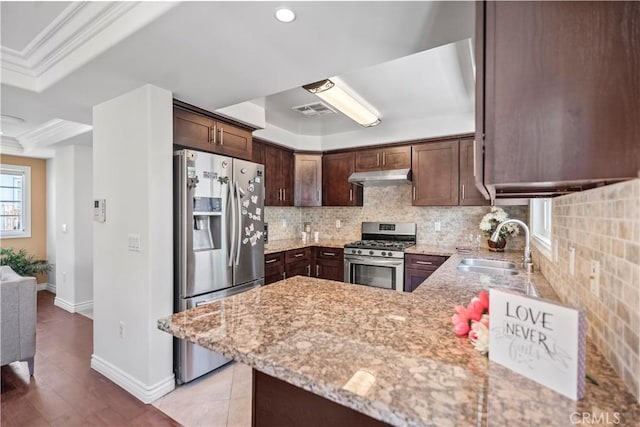 1128 Huntington Dr Unit C, South Pasadena, CA 91030 - kitchen featuring stainless steel appliances, under cabinet range hood, dark brown cabinetry, light stone countertops, and ornamental molding