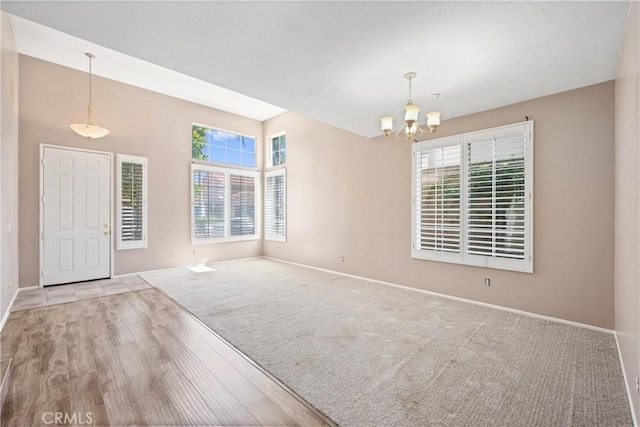 15353 Isabel Ln, Fontana, CA 92336 - entrance foyer featuring a chandelier, wood finished floors, and carpet floors