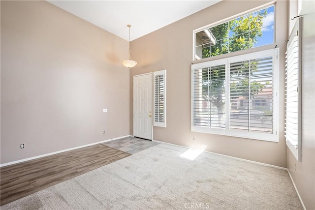 15353 Isabel Ln, Fontana, CA 92336 - carpeted empty room with plenty of natural light and a high ceiling