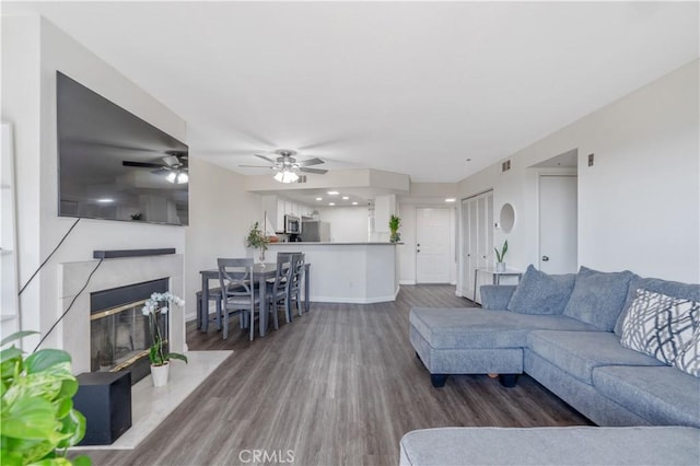 3623 Legato Ct, Pomona, CA 91766 - living area featuring wood finished floors, a fireplace, and a ceiling fan