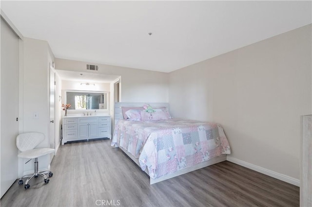 3623 Legato Ct, Pomona, CA 91766 - bedroom with wood finished floors and ensuite bath