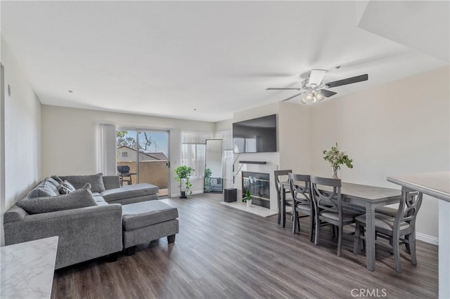 3623 Legato Ct, Pomona, CA 91766 - living area featuring dark wood finished floors, a ceiling fan, and a glass covered fireplace