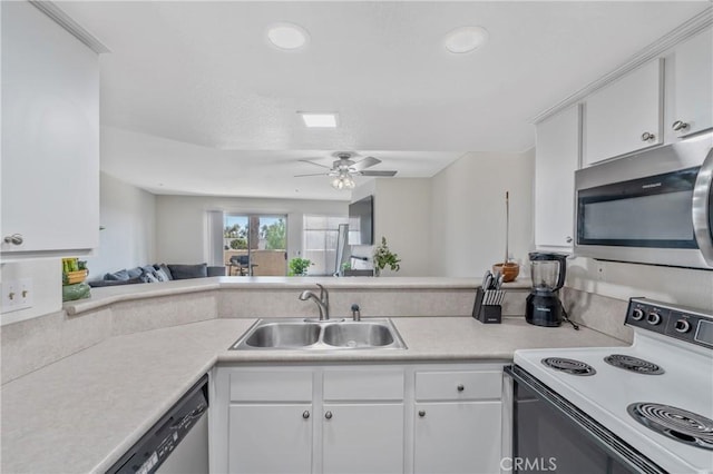 3623 Legato Ct, Pomona, CA 91766 - kitchen featuring appliances with stainless steel finishes, light countertops, white cabinets, and recessed lighting