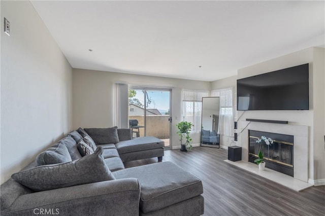 3623 Legato Ct, Pomona, CA 91766 - living area featuring wood finished floors and a glass covered fireplace