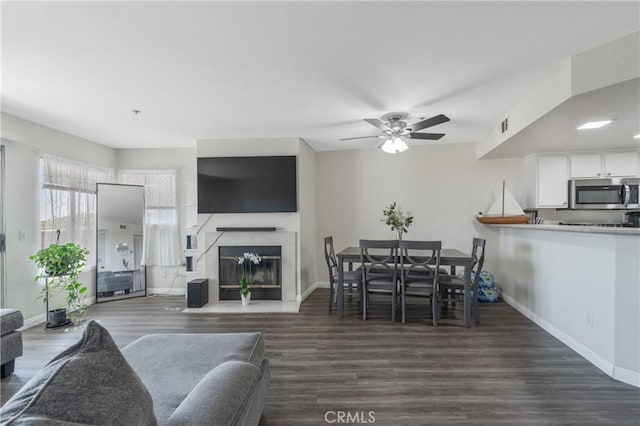 3623 Legato Ct, Pomona, CA 91766 - living area with wood finished floors, ceiling fan, and a fireplace with flush hearth