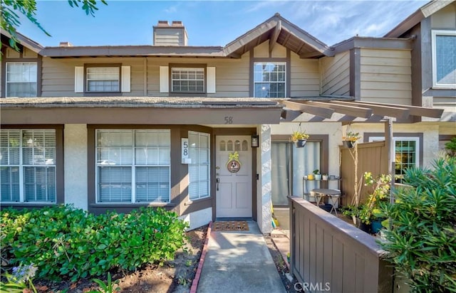 2323 S Cutty Way Unit 58, Anaheim, CA 92802 - doorway to property featuring a chimney