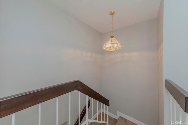 2323 S Cutty Way Unit 58, Anaheim, CA 92802 - staircase featuring a chandelier and baseboards