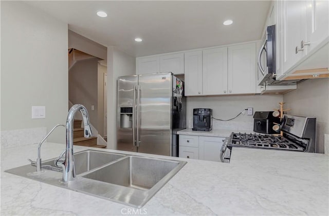 2323 S Cutty Way Unit 58, Anaheim, CA 92802 - kitchen with stainless steel appliances, white cabinets, light countertops, and recessed lighting