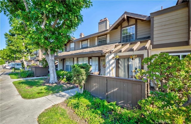 2323 S Cutty Way Unit 58, Anaheim, CA 92802 - view of front of house with a chimney