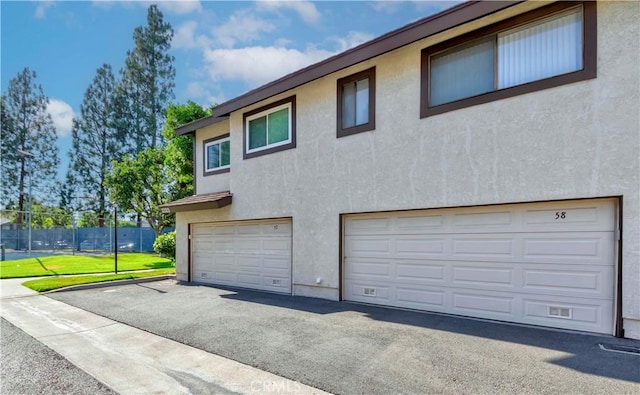 2323 S Cutty Way Unit 58, Anaheim, CA 92802 - garage with asphalt driveway