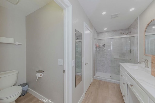 2323 S Cutty Way Unit 58, Anaheim, CA 92802 - bathroom with wood finished floors, vanity, a stall shower, and recessed lighting