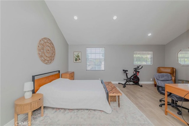 2323 S Cutty Way Unit 58, Anaheim, CA 92802 - bedroom featuring light wood-style flooring, recessed lighting, and lofted ceiling
