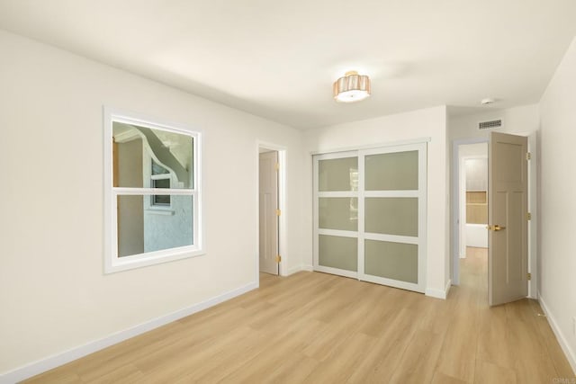 4936 Mount Elbrus Dr, San Diego, CA 92117 - spare room with light wood-style floors and baseboards