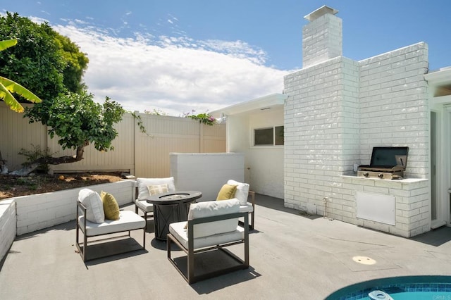 4936 Mount Elbrus Dr, San Diego, CA 92117 - view of patio / terrace with an outdoor living space with a fire pit