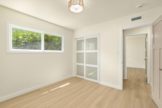 4936 Mount Elbrus Dr, San Diego, CA 92117 - unfurnished bedroom with light wood-type flooring and baseboards