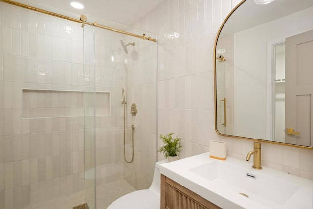 4936 Mount Elbrus Dr, San Diego, CA 92117 - bathroom featuring a stall shower, tile walls, vanity, and tasteful backsplash