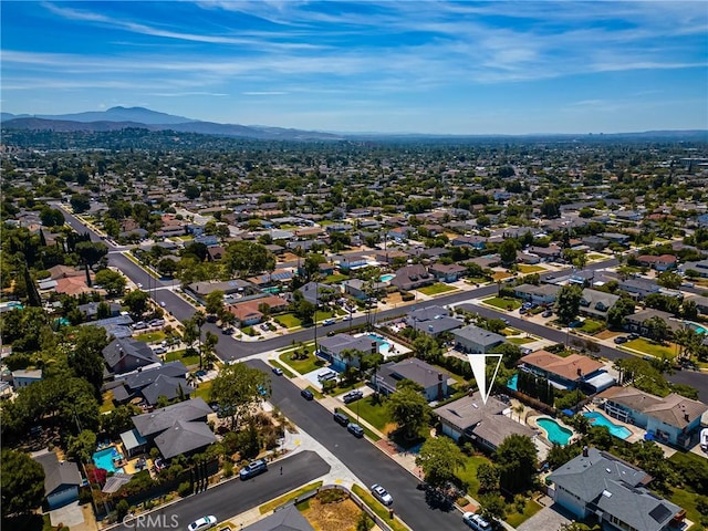 17542 Rainier Dr, North Tustin, CA 92705 - aerial view of property and surrounding area with mountains and a pool area
