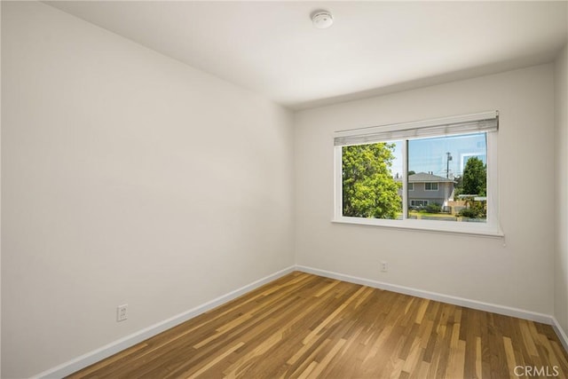 17542 Rainier Dr, North Tustin, CA 92705 - empty room featuring wood finished floors and a smoke detector
