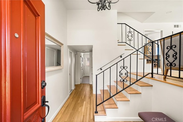 17542 Rainier Dr, North Tustin, CA 92705 - foyer with wood finished floors, stairs, and a chandelier