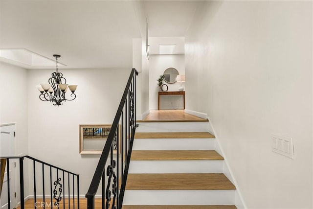 17542 Rainier Dr, North Tustin, CA 92705 - stairway with a chandelier and baseboards