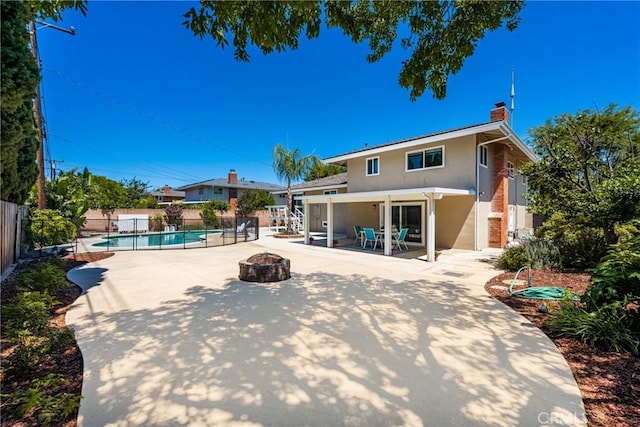 17542 Rainier Dr, North Tustin, CA 92705 - view of pool featuring a fire pit, a patio area, and a fenced backyard