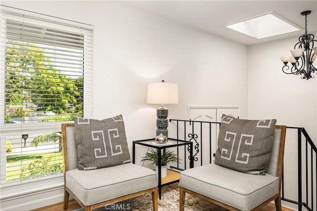 17542 Rainier Dr, North Tustin, CA 92705 - sitting room featuring a chandelier, a skylight, and wood finished floors