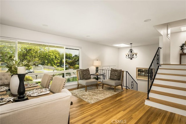 17542 Rainier Dr, North Tustin, CA 92705 - living room featuring a chandelier, wood finished floors, and stairway