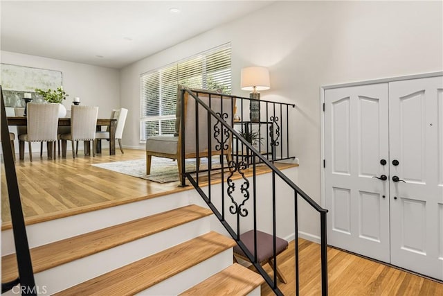 17542 Rainier Dr, North Tustin, CA 92705 - stairs featuring wood finished floors and recessed lighting