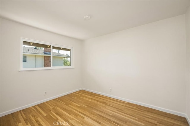 17542 Rainier Dr, North Tustin, CA 92705 - empty room featuring light wood-style flooring and a smoke detector