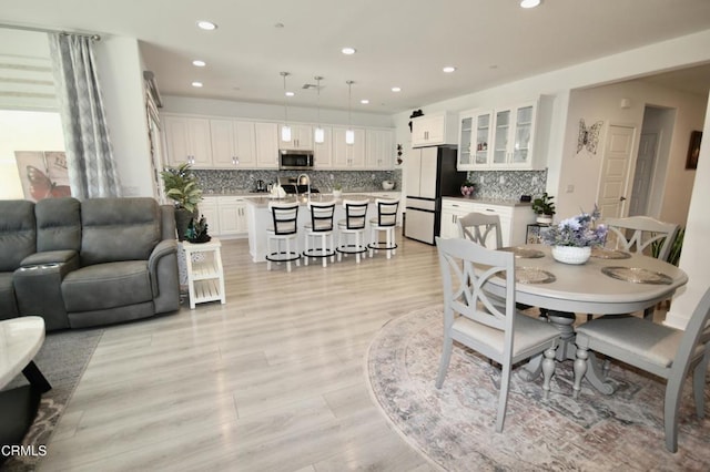 1622 Trailview Dr, Beaumont, CA 92223 - dining area with recessed lighting and light wood-type flooring