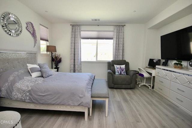 1622 Trailview Dr, Beaumont, CA 92223 - bedroom with multiple windows, light wood finished floors, and an office area