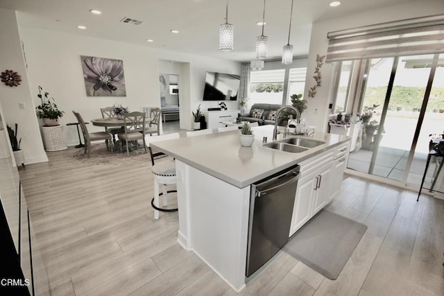 1622 Trailview Dr, Beaumont, CA 92223 - kitchen featuring stainless steel dishwasher, light countertops, recessed lighting, white cabinetry, and light wood-type flooring