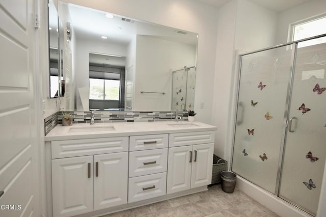 1622 Trailview Dr, Beaumont, CA 92223 - full bathroom with healthy amount of natural light, a stall shower, double vanity, and backsplash