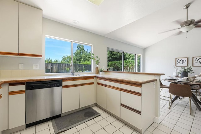 5452 Gooseberry Way, Oceanside, CA 92057 - kitchen with dishwasher, a peninsula, vaulted ceiling, ceiling fan, and light tile patterned floors