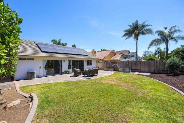 5452 Gooseberry Way, Oceanside, CA 92057 - back of property featuring roof mounted solar panels, a patio, stucco siding, a fenced backyard, and an outdoor living space