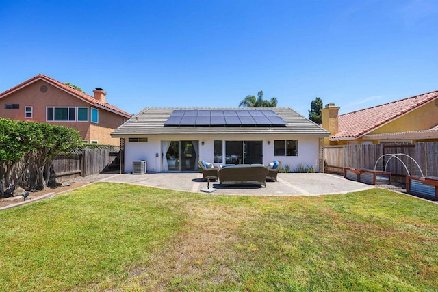 5452 Gooseberry Way, Oceanside, CA 92057 - rear view of house with solar panels, a patio area, a fenced backyard, an outdoor living space, and stucco siding