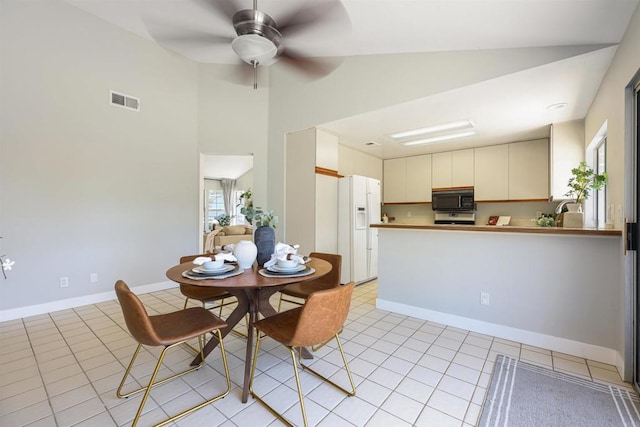 5452 Gooseberry Way, Oceanside, CA 92057 - dining area with ceiling fan, light tile patterned floors, and high vaulted ceiling