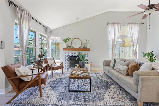 5452 Gooseberry Way, Oceanside, CA 92057 - living room featuring lofted ceiling, healthy amount of natural light, a ceiling fan, wood finished floors, and a tile fireplace