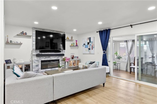 6002 Calvin Cir, Huntington Beach, CA 92647 - living room with a fireplace, light wood-type flooring, and recessed lighting