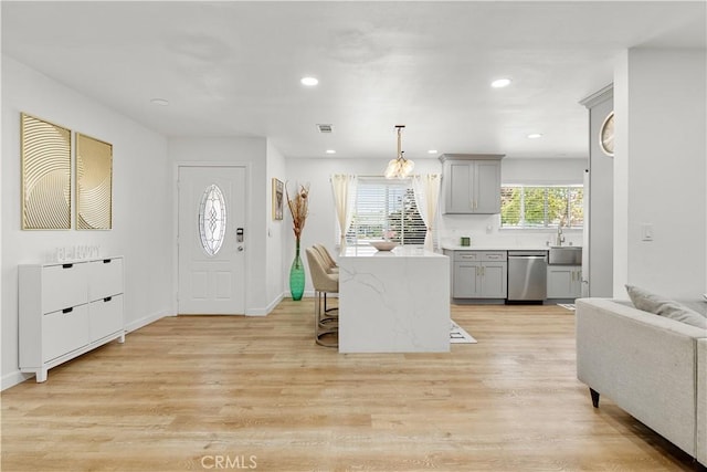 6002 Calvin Cir, Huntington Beach, CA 92647 - foyer entrance featuring light wood-style flooring, a chandelier, and recessed lighting