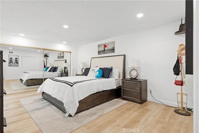 6002 Calvin Cir, Huntington Beach, CA 92647 - bedroom featuring wood finished floors, recessed lighting, and a closet