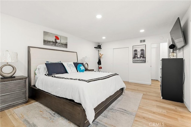 6002 Calvin Cir, Huntington Beach, CA 92647 - bedroom featuring a closet, recessed lighting, and light wood-type flooring