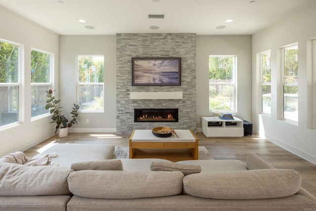 744 Adelaide Cir, Encinitas, CA 92024 - living area with a fireplace, light wood-style floors, and recessed lighting