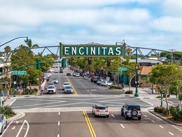 744 Adelaide Cir, Encinitas, CA 92024 - view of asphalt street featuring traffic lights, curbs, street lights, traffic signs, and sidewalks